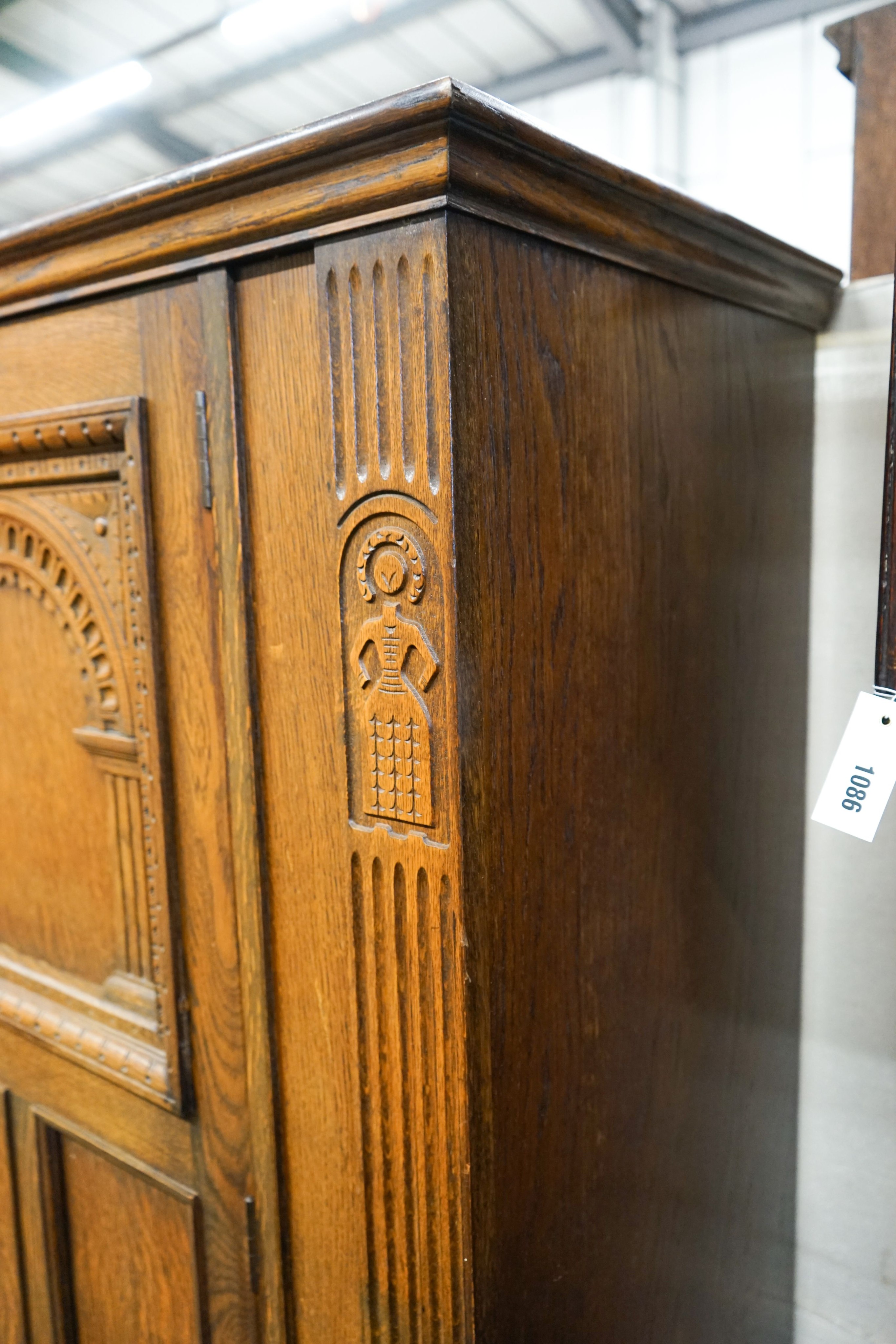 An 18th century style carved oak hall cupboard, length 91cm, depth 50cm, height 180cm